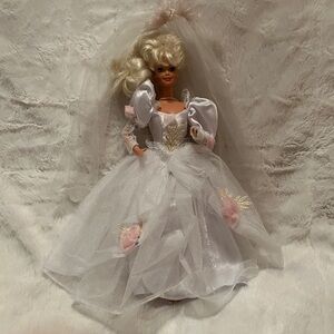 This is a 1992 Mattel Romantic Bride Barbie doll, model number 1861.